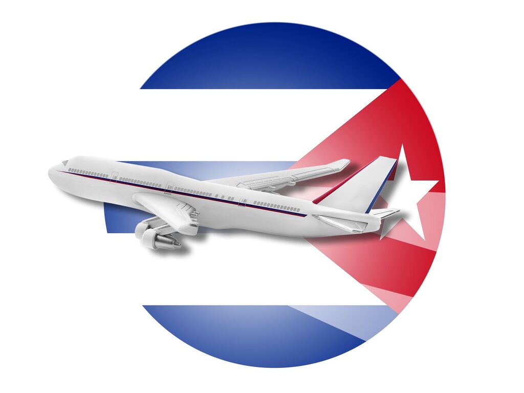 Cuban plane infront of Cuban flag