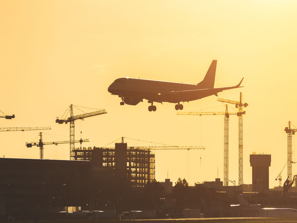 Airplane landing at sunset at London City airport